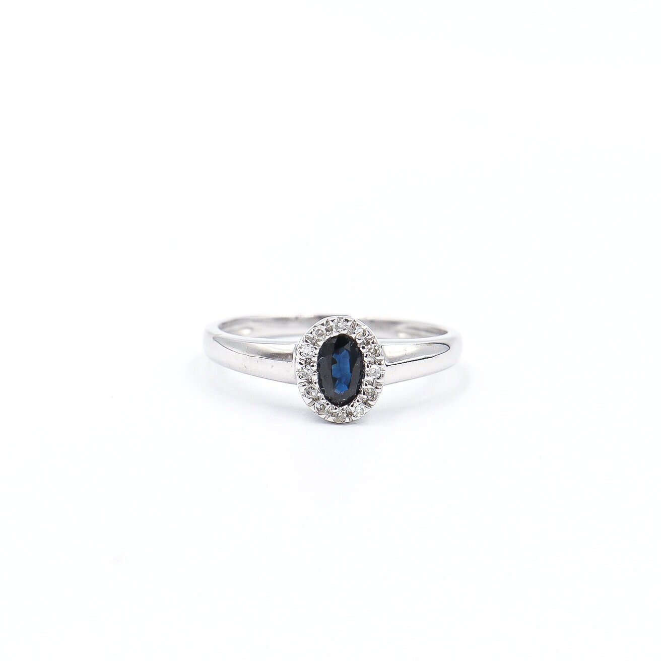 14 Karat White Gold Sapphire and Diamond Oval Halo Ring