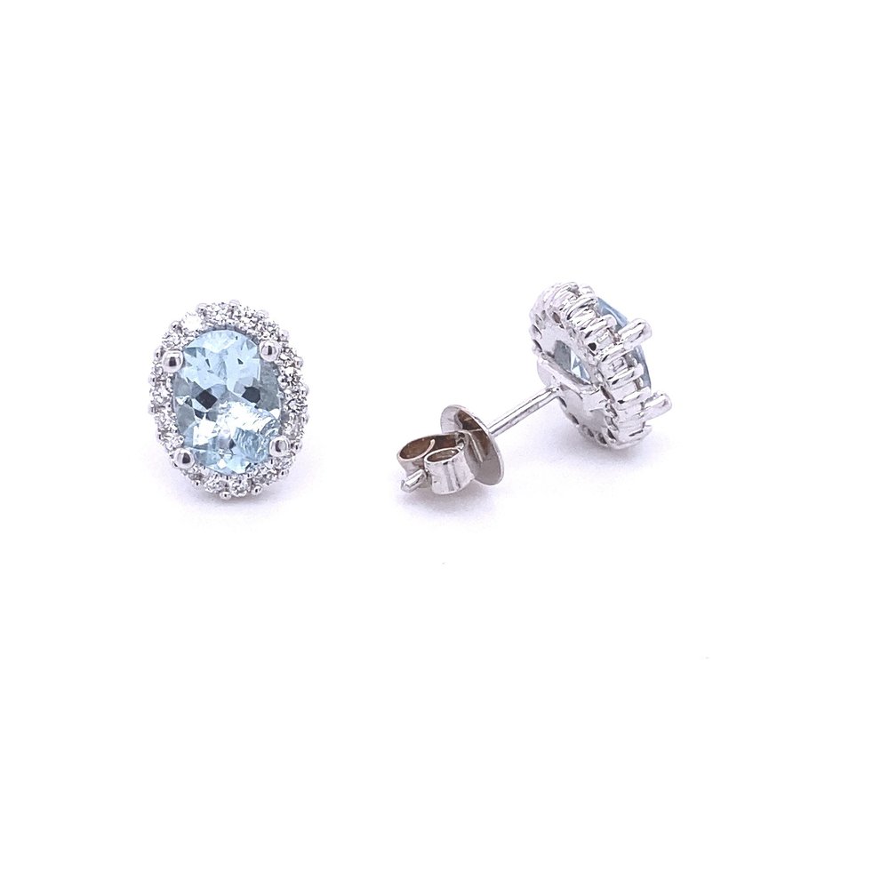 14 Karat White Gold Blue Topaz and Diamond Halo Oval Stud Earrings